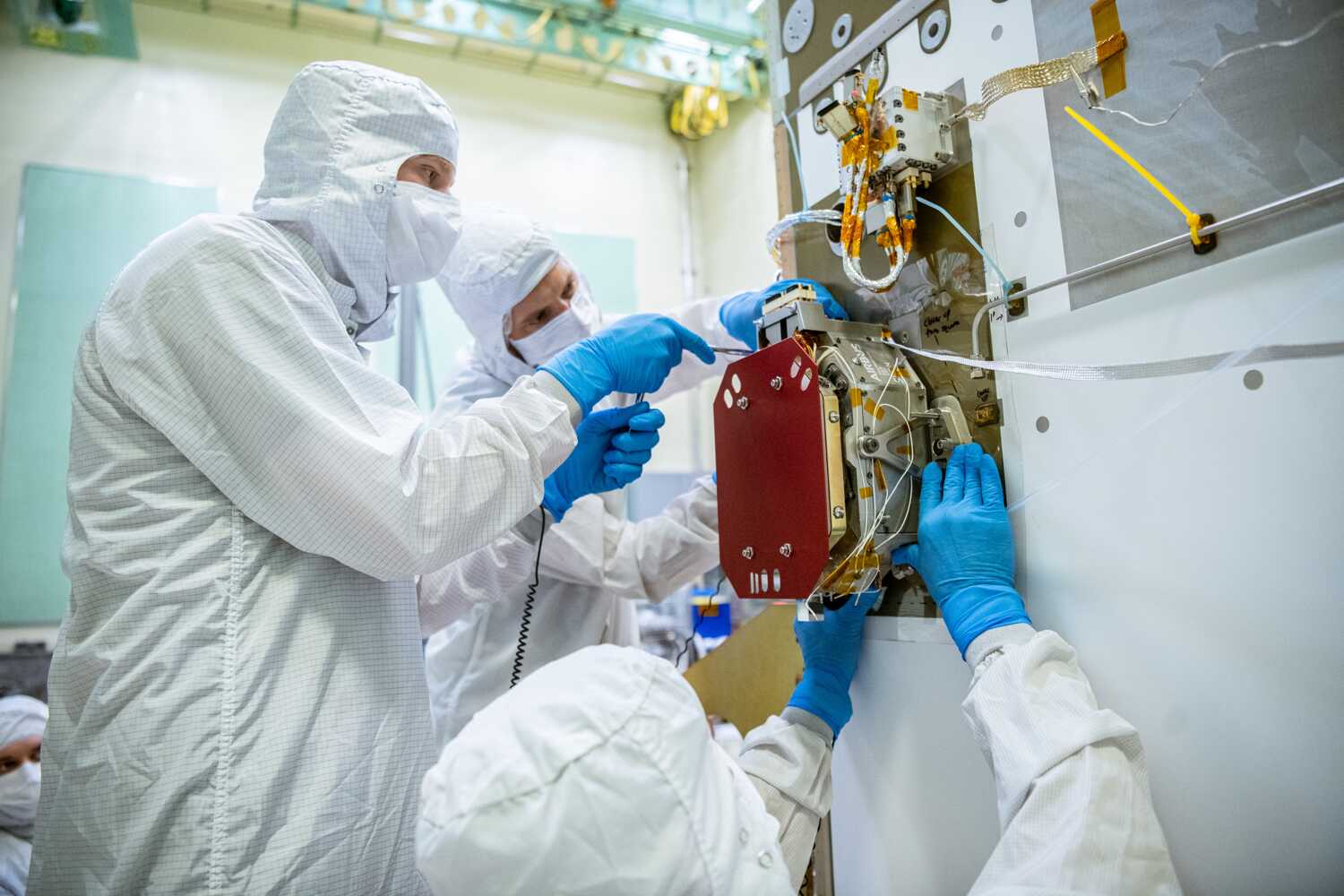 SRON engineers mount the Dutch SPEXone instrument on NASA’s PACE satellite at Goddard Space Flight Center. Credit: GSFC