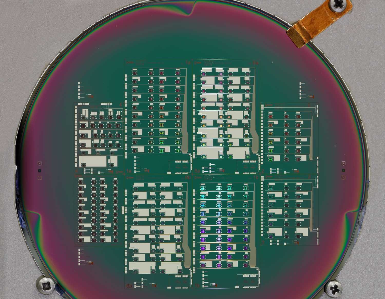 Lithografy: wafer with superconducting LC filter chips for read out of detectors.